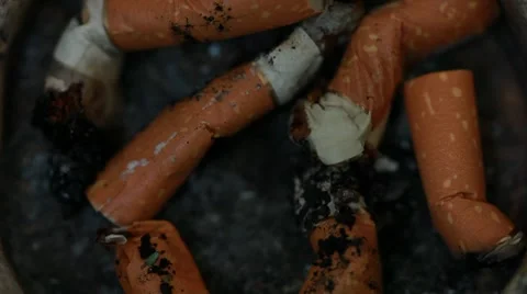 Cigarettes butts in the ashtray Stock Footage 8963931