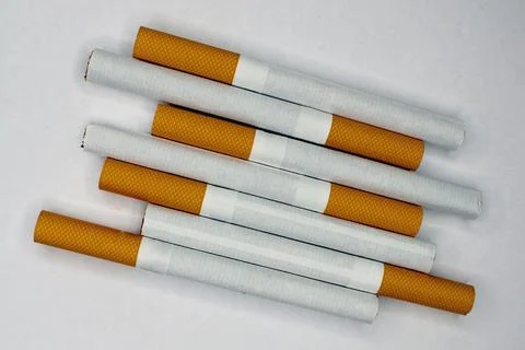 Cigarettes close-up on a light background. The concept of anti-smoking. Stock Photos