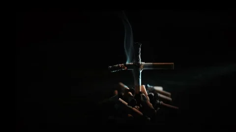 Cigarettes with a cross on the grave Stock Footage 72192644