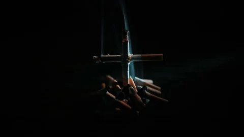 Cigarettes with a cross on the grave Stock Footage 72192660