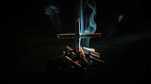 Cigarettes with a cross on the grave Stock Footage 72207825