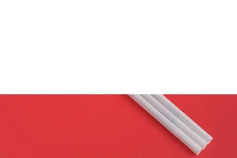 Cigarettes on a light pink background. Stock Photos