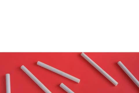 Cigarettes on a light pink background. Stock Photos