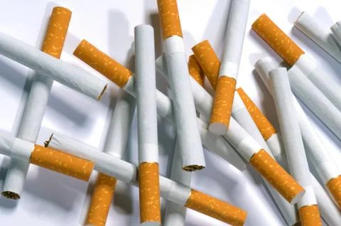 Cigarettes lying on a white background Foto stock