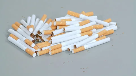 Cigarettes scattered on the table Stock Footage 44912293