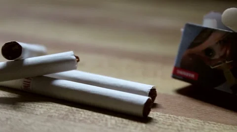 Cigarettes on a Table Stock Footage 42372689
