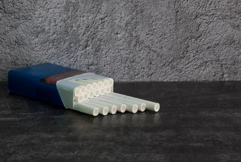Cigarettes with a white filter in a blue pack it's Time to stop Smoking Stock Photos