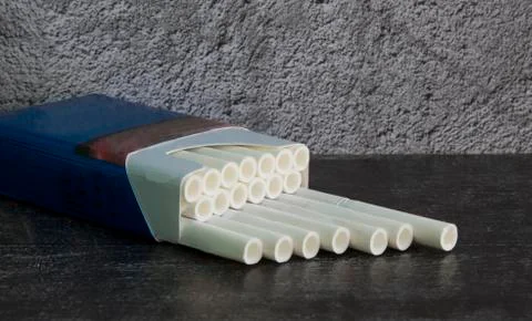 Cigarettes with a white filter in a blue pack it's Time to stop Smoking Stock Photos