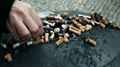 Cigarretes hand and ashtray Stock Footage