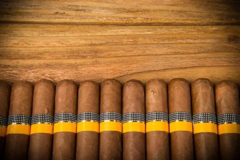 Cigars on rustic table Stock Photos