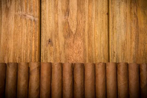 Cigars on rustic table Stock Photos