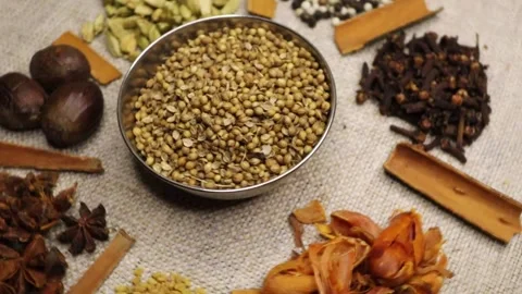 Cilantro coriander seeds spinning clockwise slowly top down view. 4k video. Stock Footage 282599439