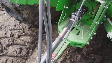 A Cinamatic Pan Over a Running PTO on a New John Deere Green Tractor Video stock 74220404