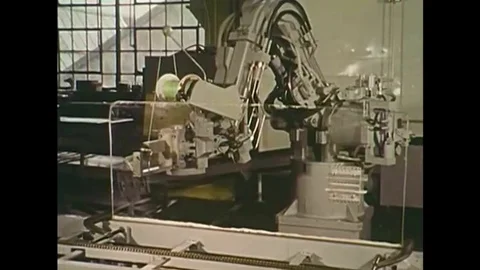 A Cincinnati Milacron 6CH Robot Arm strings wire between fixtures, in 1975. Video stock 147391394