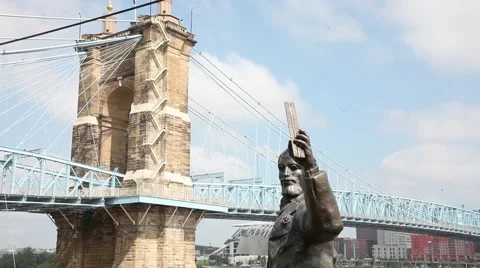 CINCINNATI, ROEBLING BRIDGE, WITH STATUE OF JOHN AUGUSTUS ROEBLING IN FOREGROUND Stock Footage 59184048