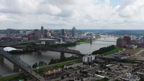 Cincinnati skyline and bridges spanning Ohio River, aerial Stock Footage 345231532