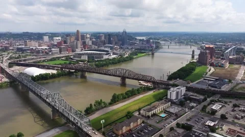 Cincinnati skyline, Ohio River bridges and waterfront stadiums, aerial Stock Footage 345232990