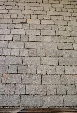 Cinder block brick wall made of concrete as background Stock Photos