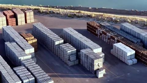 Cinder blocks and pavers stacked at an outdoor loading area - tilt down drone Stock Footage 342093343
