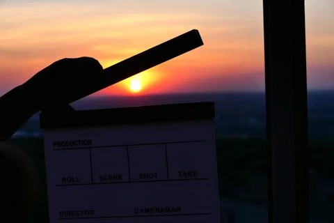 Cinema. Director's, cinema clapperboard. film shooting at sunset Stock Photos