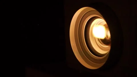 Cinema hall. Projector lens in operation. Movie is shown through projector Stock Footage 278322693