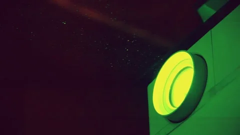 Cinema hall. Projector in operation. Dust is visible in green rays of light Stock Footage 286700241