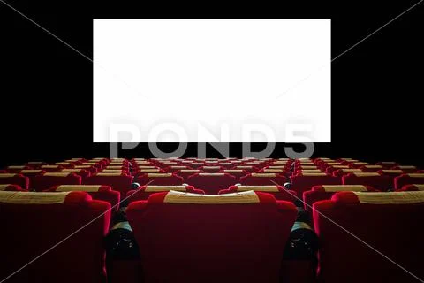 Cinema hall with red seat and wide white screen Stock Photos