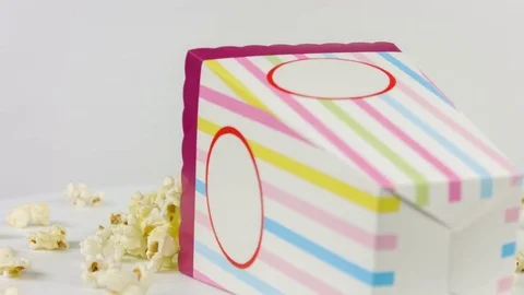 Cinema popcorn on a white background close up rotation Stock Footage 76385514