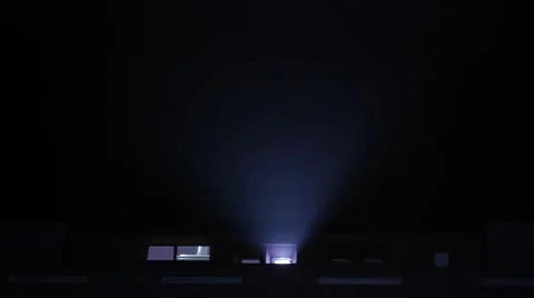 Cinema projector and projects the image and flickers in the dark Stock Footage 53278084