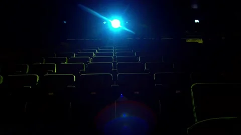 Cinema, spotlight illuminates chairs Stock Footage 131088513