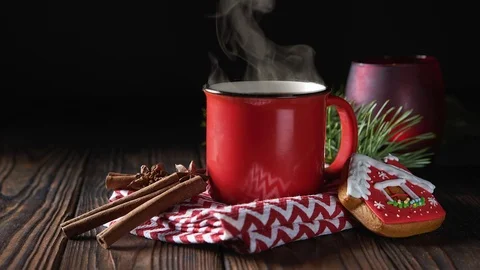 Cinemagrah loop. Hot chocolate in red mug with cinnamon and gingerbread on Stock Footage 122687887