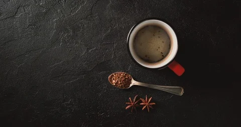 Cinemagrah loop. Steaming coffee cup on dark background. Top view with copy Stock Footage 122687994