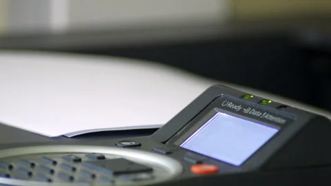 Cinemagraph of A4 sheets being printed out of a printer Stock Footage 285522639