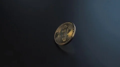 Cinemagraph Bitcoin Spining in Slow Motion Black Surface Stock Footage 81504032