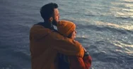 Cinemagraph. Caucasian Couple Enjoying The View Of A Sunset Over Lake Stock Footage
