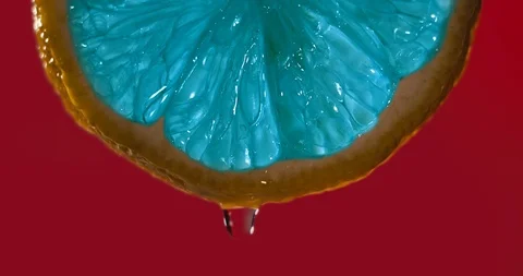 Cinemagraph - Close up or macro of a blue slice of lemon Stock Footage 99623119
