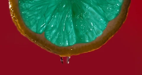 Cinemagraph - Close up or macro of a emerald slice of lemon Stock Footage 99623133