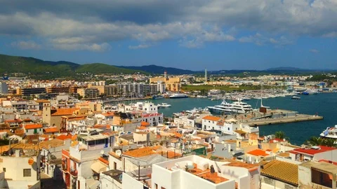 Cinemagraph - Clouds floating over the port of the Town of Ibiza on Ibiza Island Stock Footage 100777532