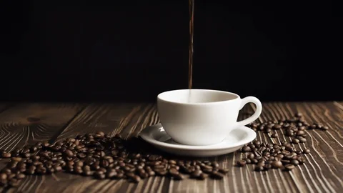 Cinemagraph. Coffee cup and coffee beans. White cup of evaporating coffee on the Stock Footage 121069108