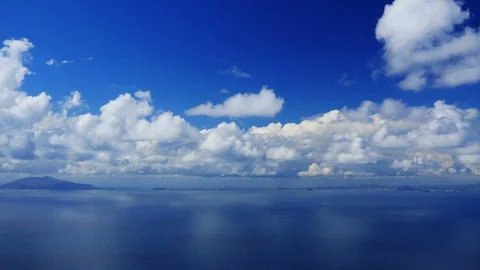 Cinemagraph Cumulus clouds over blue sea time-lapse. Video stock 106248859