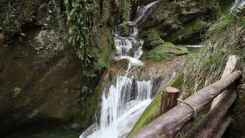 Cinemagraph effect of waterfalls with partially still water in a gorge Stock Footage 129570455
