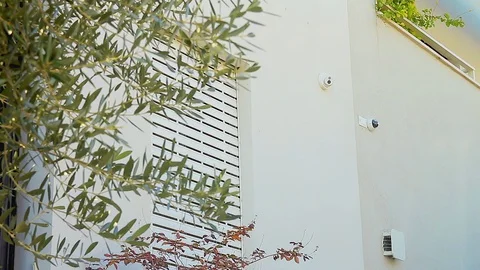 Cinemagraph of an electric rolling shutter opening on a window Stock Footage 129548553