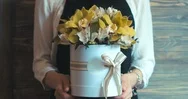 Cinemagraph - Female Florist Wearing Apron Holding Beautiful Flower Bouquet Stock Footage