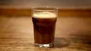 Cinemagraph Of Glass Of Coffee With Cream Stock Footage