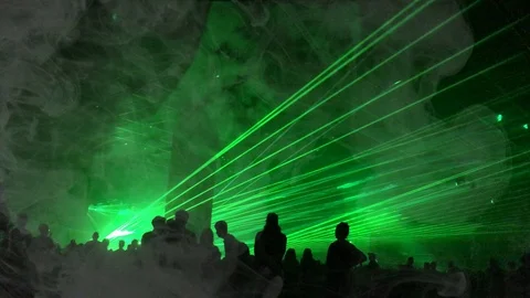 Cinemagraph - green laser rays and fog at a party. Psychedelic effect Stock Footage 100794368