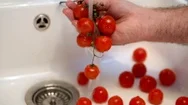 Cinemagraph Of Hand Washing Tomatoes In Sink Stock Footage