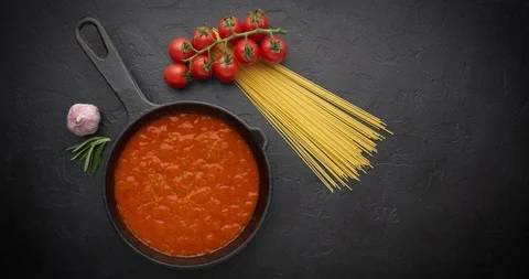 Cinemagraph loop. Bubbling hot tomato sauce for pasta, cooking in pan. Top view Stock Footage 120607701