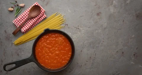 Cinemagraph loop. Bubbling hot tomato sauce for spaghetti, cooking in pan. Stock Footage 120607720