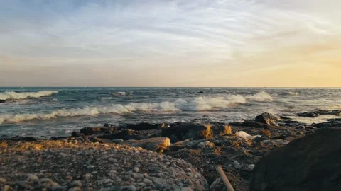 Cinemagraph loop of dramatic sunset at a rocky beach Video stock 142494500