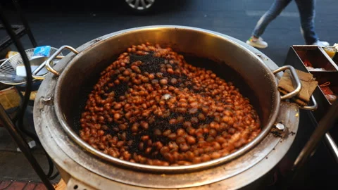Cinemagraph loop motion of iosk selling roasted chestnuts on the street Stock Footage 152657531